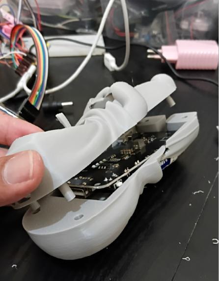 Opened toy enclosure showing its internal electronic circuit board